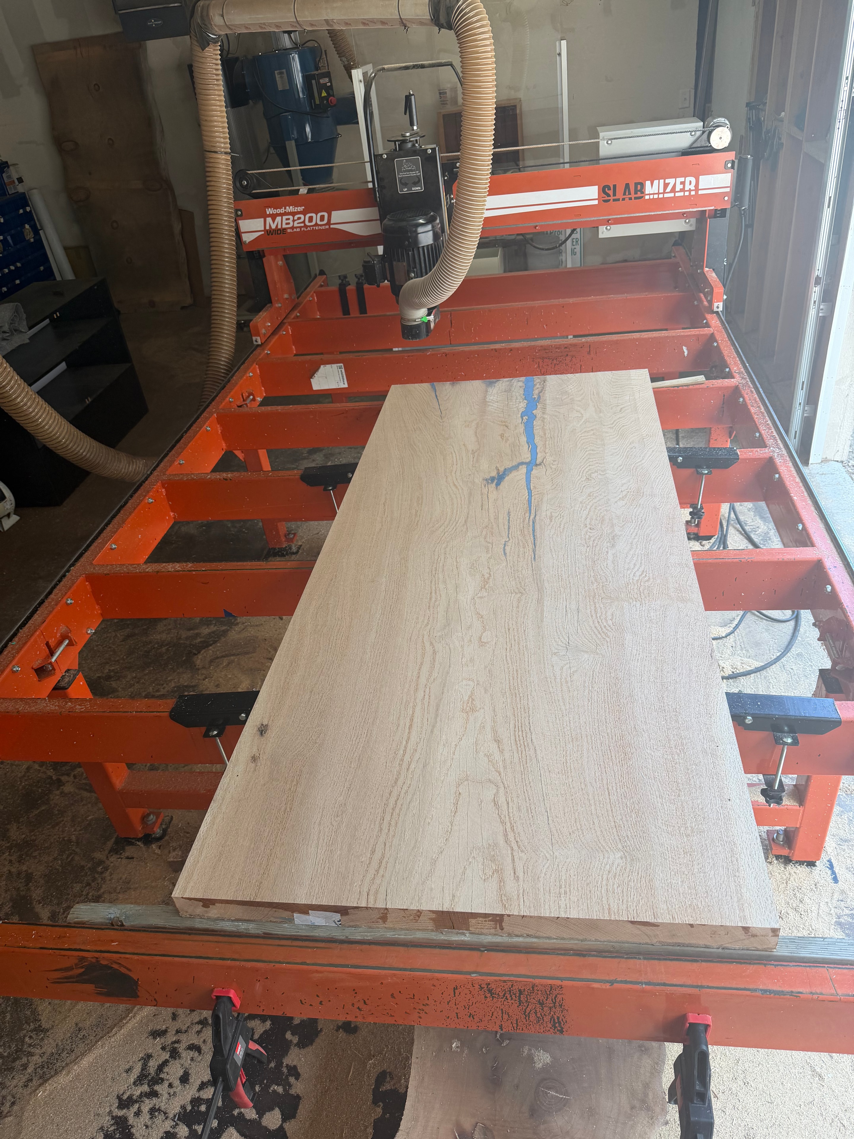 Flattening a slab on the Woodmizer Slab Mizer